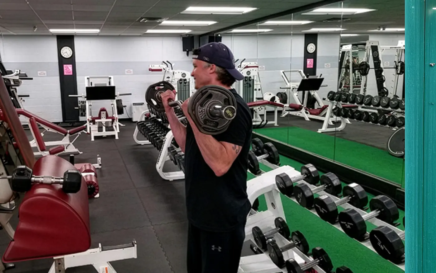 Guy lifting free weights