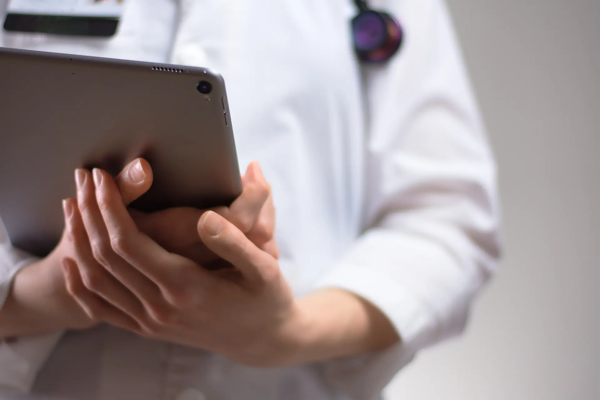 Medical professional holding paperwork